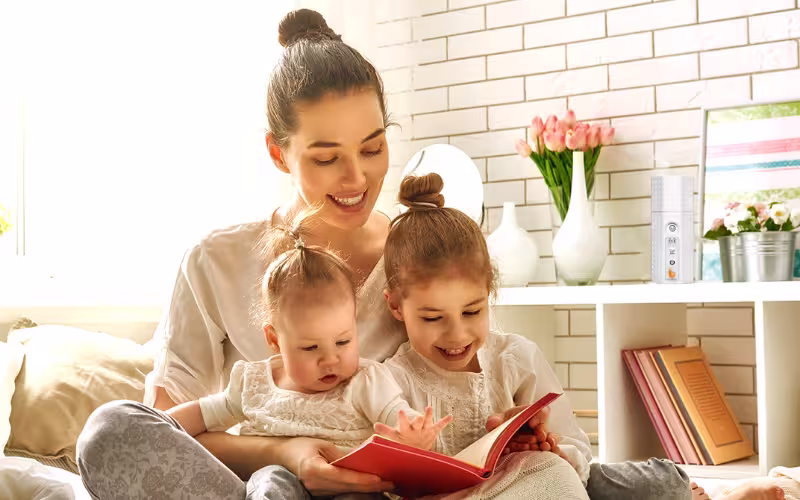 Parent and baby in a fresh nursery